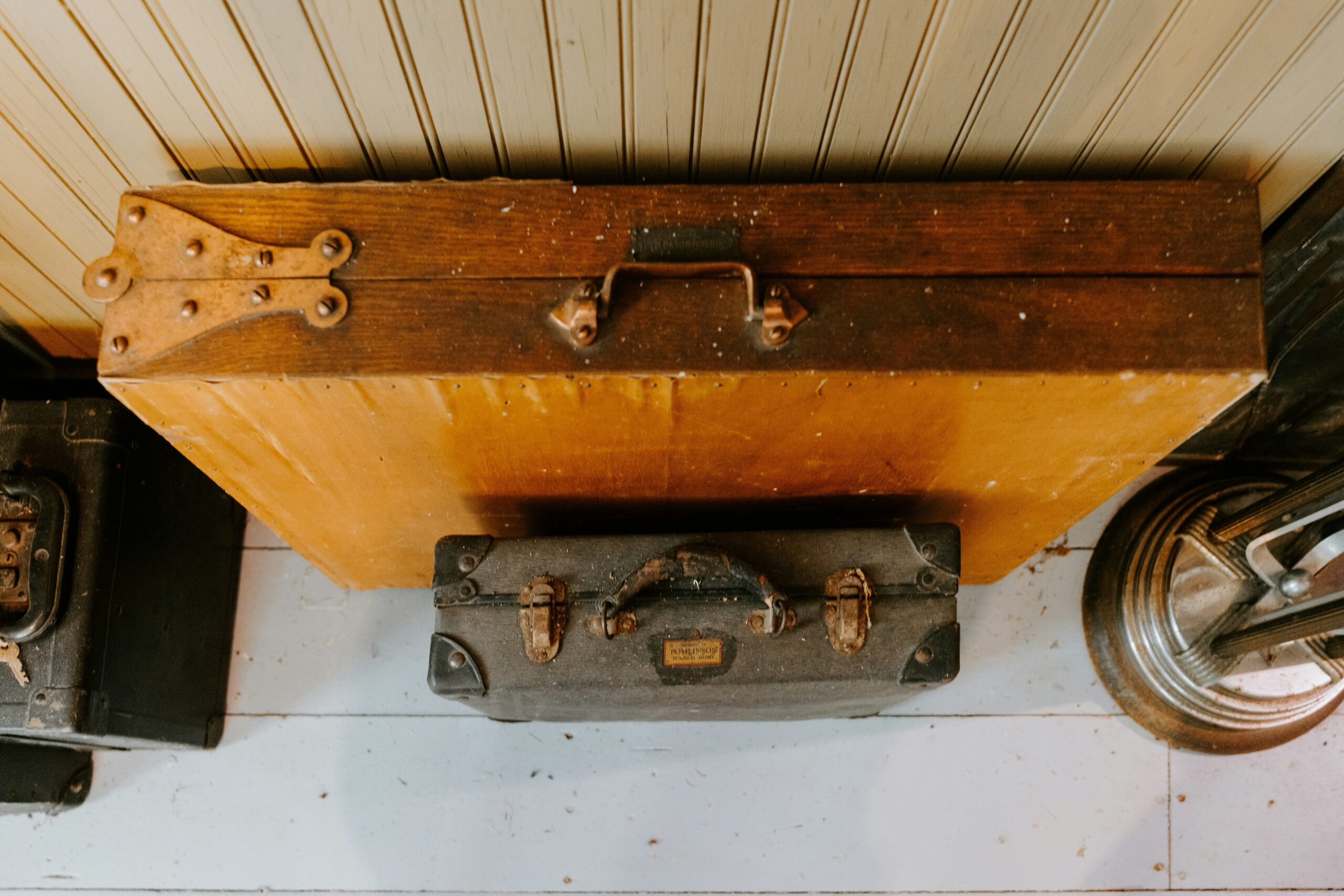 Before and after photos showing repaired luggage post-claim settlement.