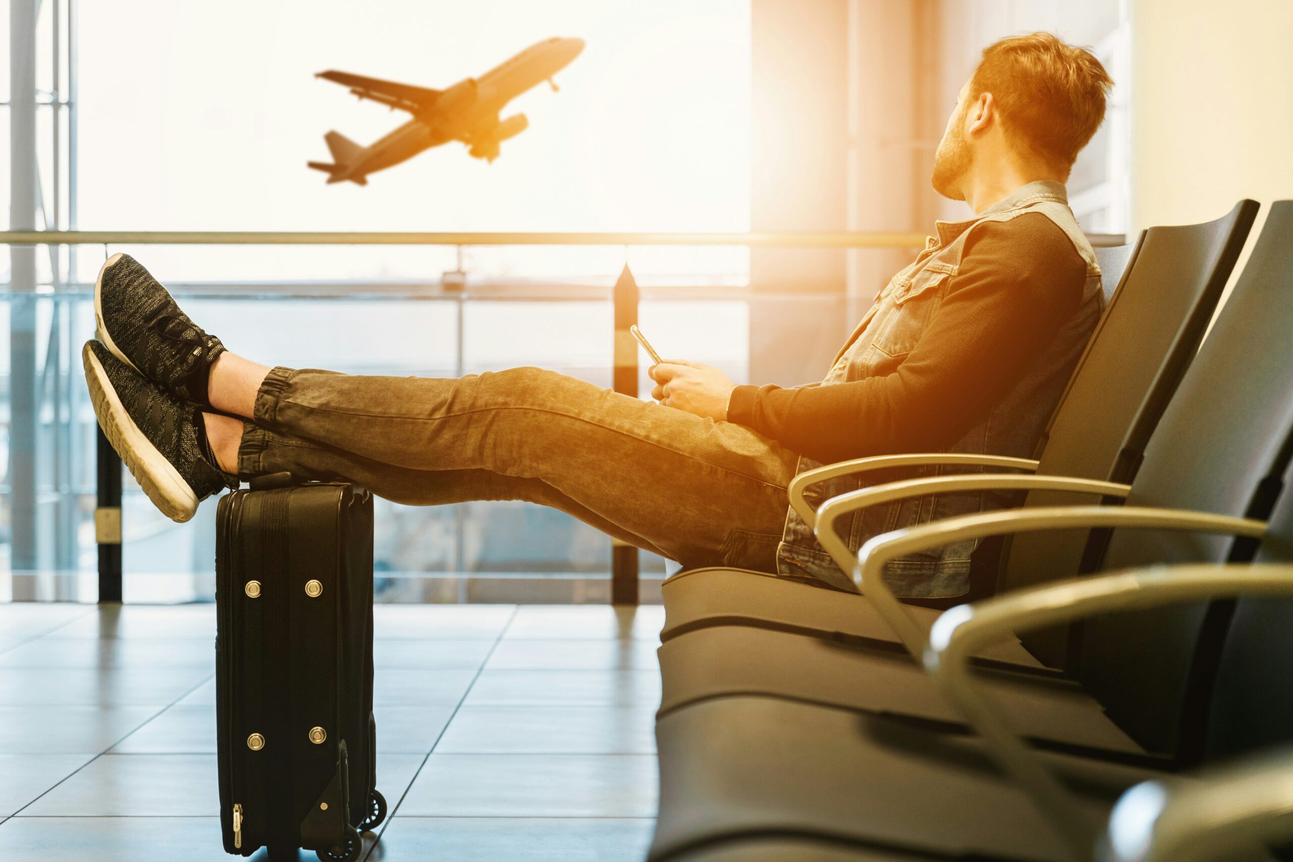 Traveler relaxing in a premium airport lounge