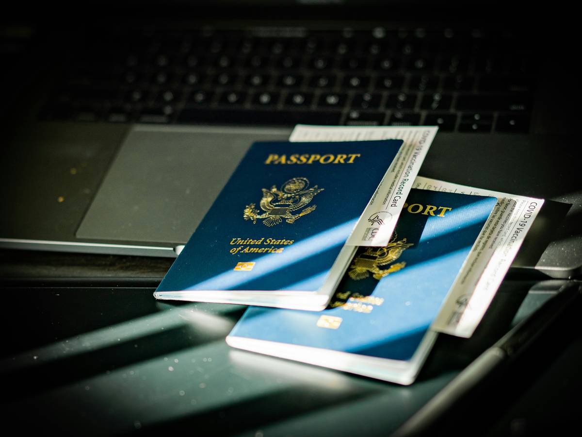 Traveler holding lost luggage ticket at airport counter