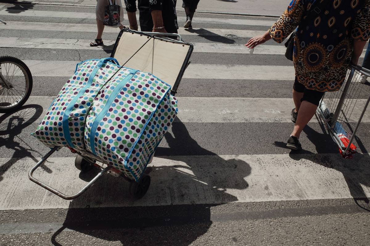 An image showing a happy traveler holding checks for a successful baggage claim.